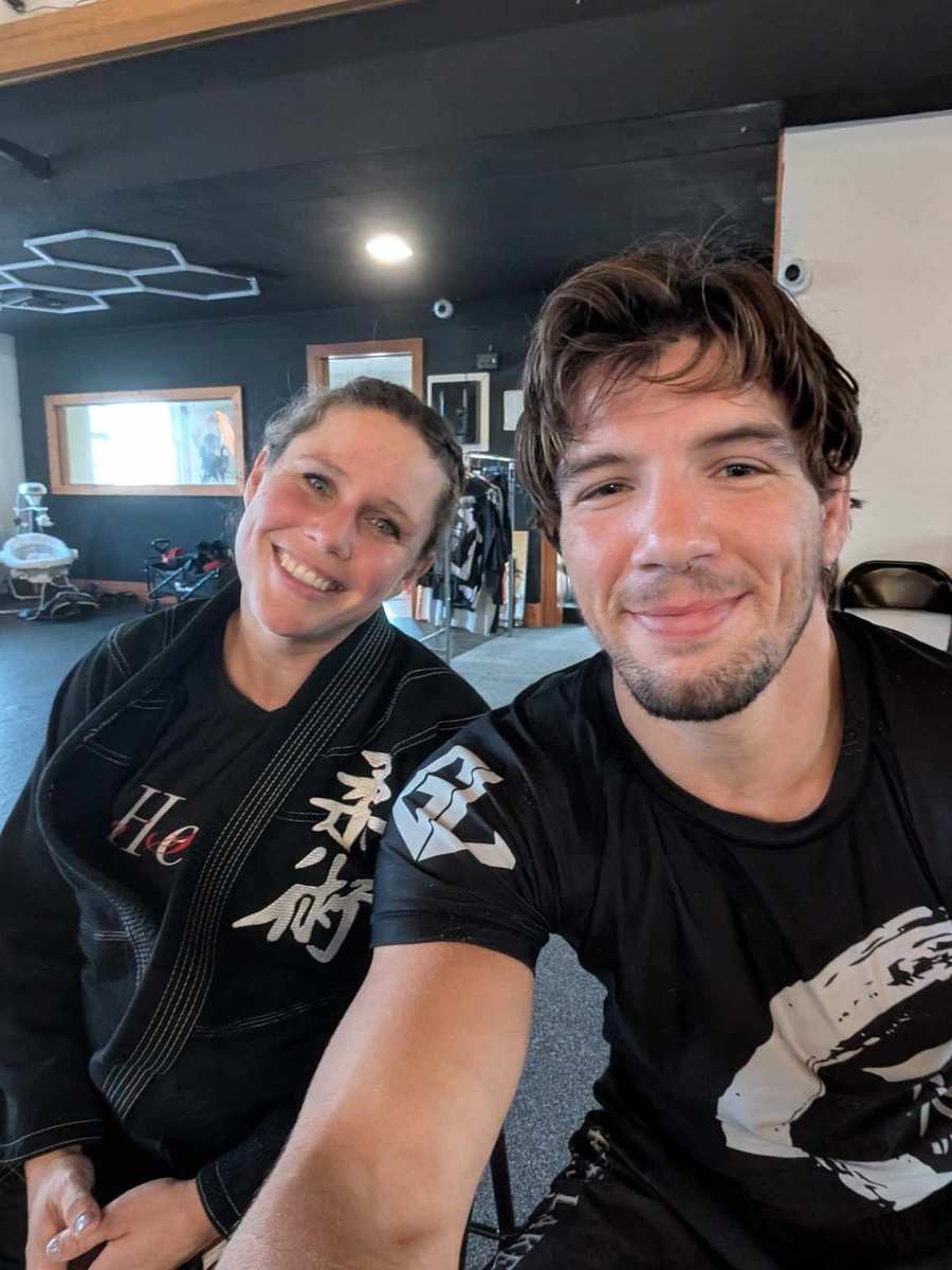 Two adult Great Lakes BJJ students together after martial arts training in Flint
