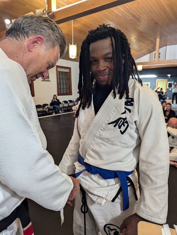 Jiu-jitsu student wearing a gi and blue belt at Great Lakes BJJ in Flint